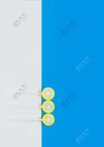 蓝色柠檬棒棒糖零食背景海报素材图片