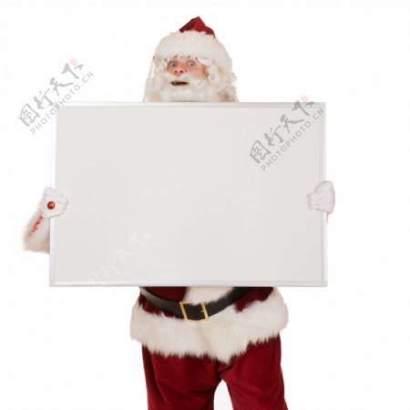 手拿空白广告牌的圣诞老人图片