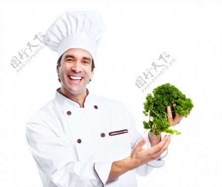 手拿蔬菜的厨师图片