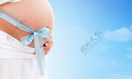 丝带与孕妇肚子图片