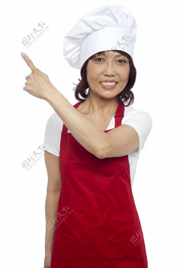 伸出一根手指的女厨师图片
